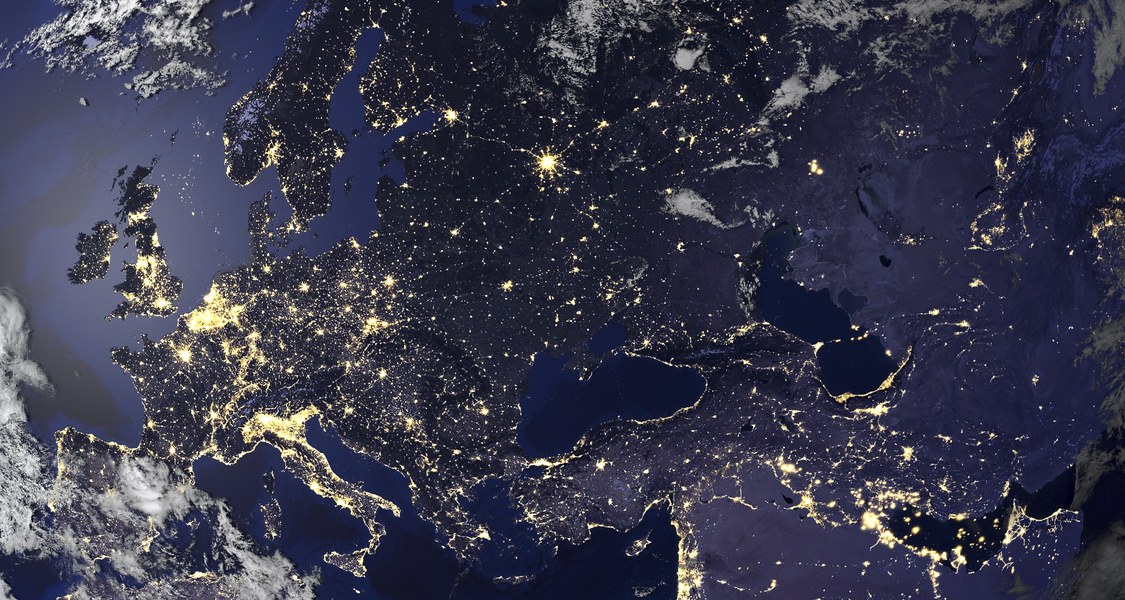 Europe viewed from space at night, cities look like yellow dots