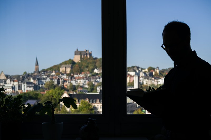 Castle and silhouette of a reader