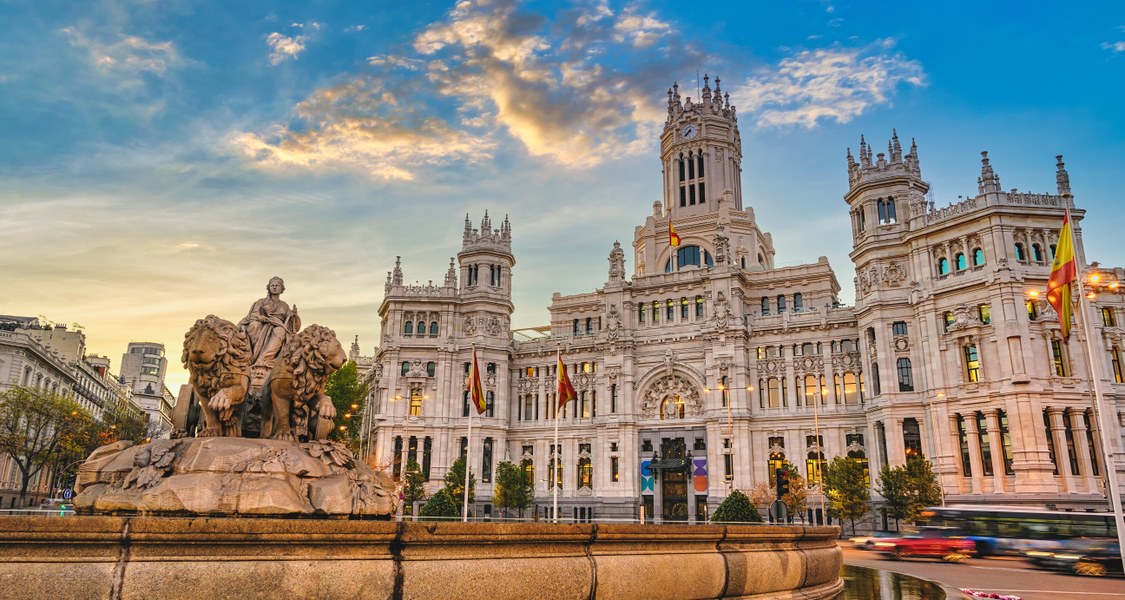 Plaza de Cibeles is one of Madrid's most emblematic landmarks, renowned for its majestic fountain featuring the Roman goddess Cybele which symbolises the city’s rich history and cultural heritage. Located at the intersection of several major avenues, it serves as a central hub and a stunning example of neoclassical architecture. The plaza is surrounded by iconic buildings, including the Palacio de Cibeles, which houses the Madrid City Hall.